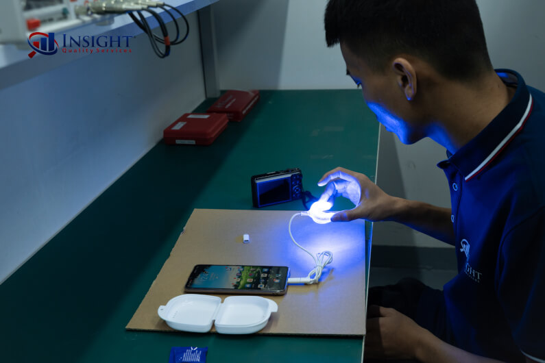 Inspector performing functional testing on tooth whitening kit