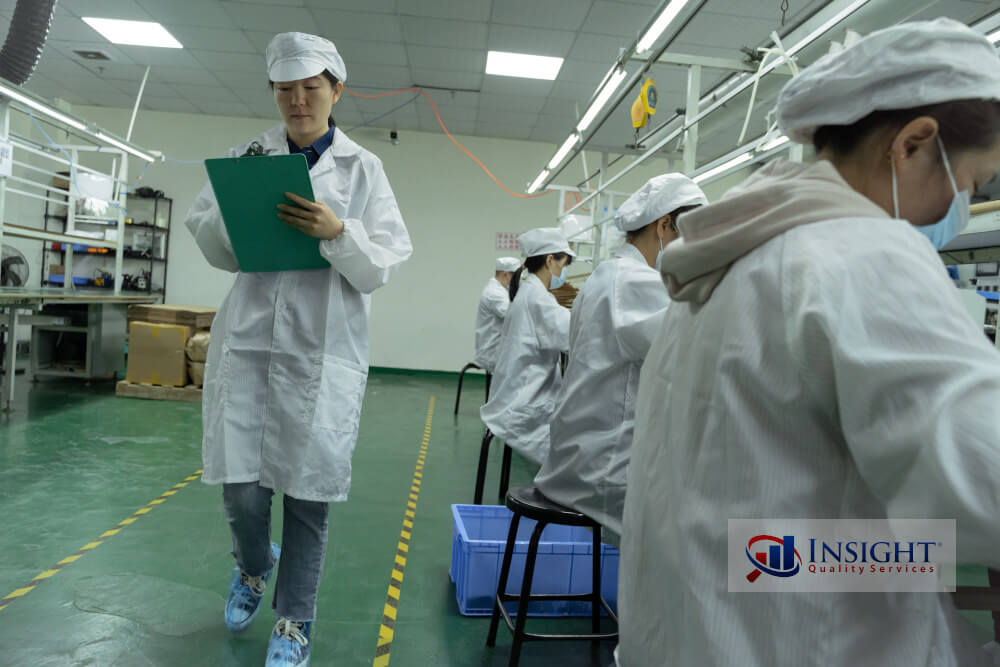 Auditor walking in factory