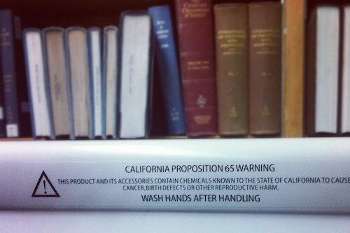 Book with proposition 65 warning label