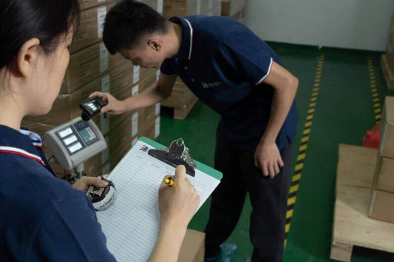 Insight Inspectors examining carton