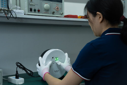 Insight inspector pushing buttons on an electronic device