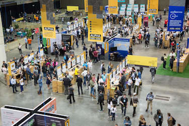 Looking down from above on the busily moving crowd at an industry conference