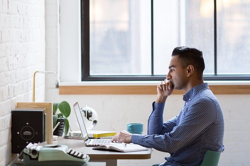 Man sitting at laptop